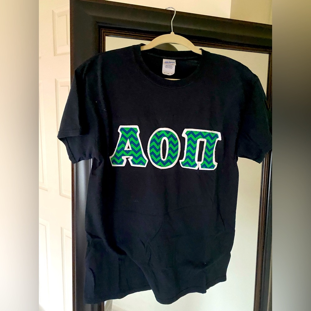 Alpha Omicron Pi black shirt with stitched green letters in size Medium